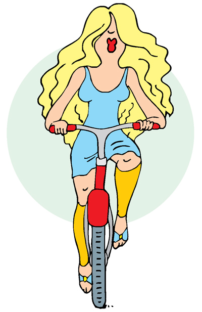 Девушка едет на велосипеде