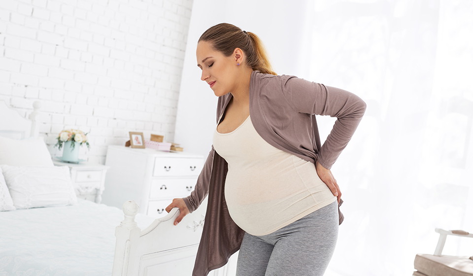 Боль в пояснице во время беременности
